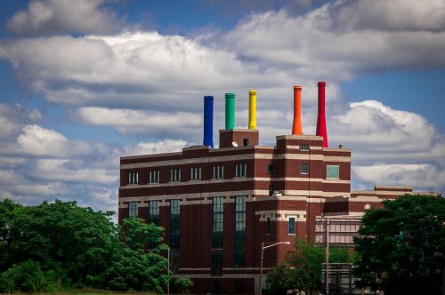 science central building with rainbow smoke stacks.